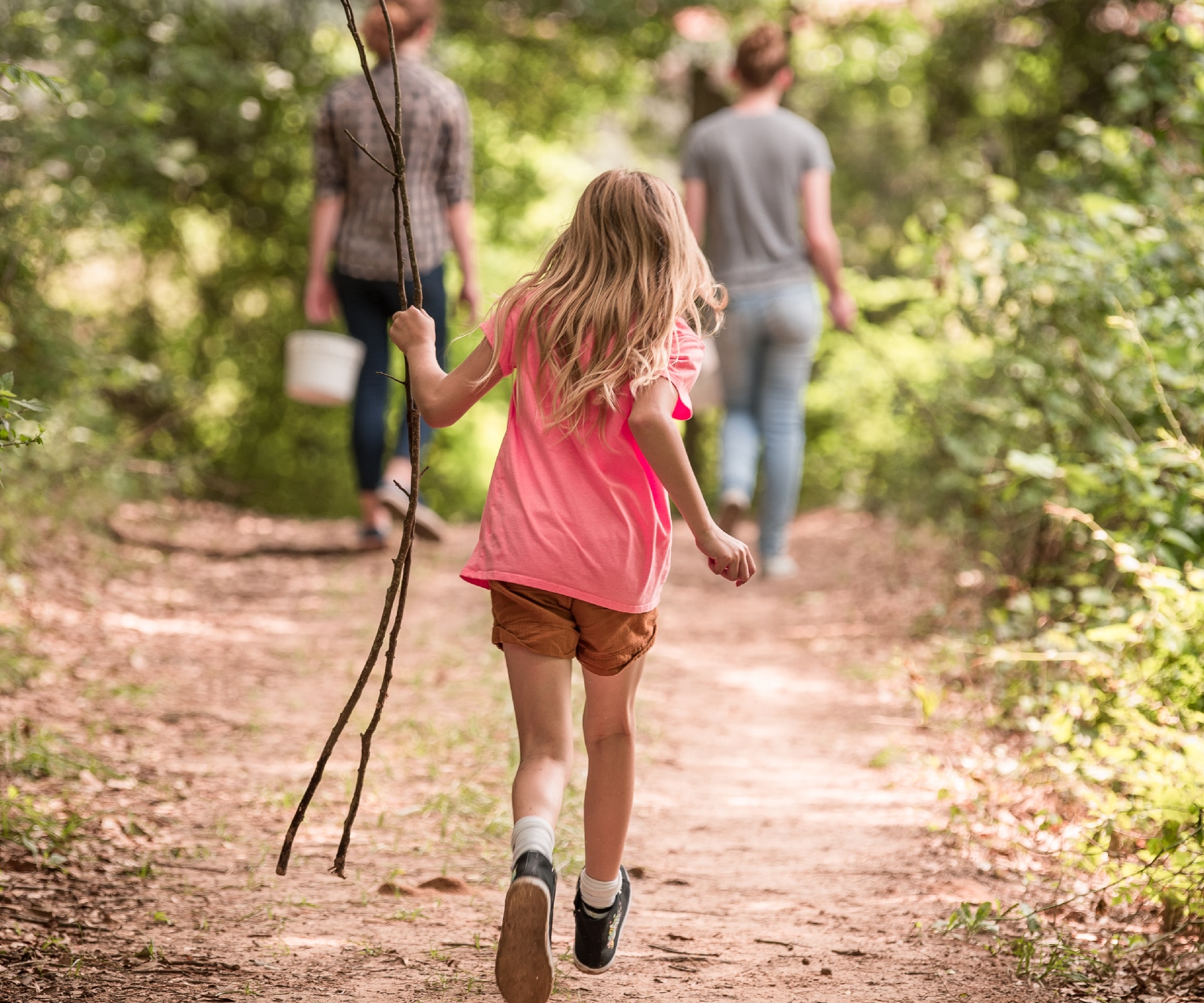 A girl running down a trail in alabama