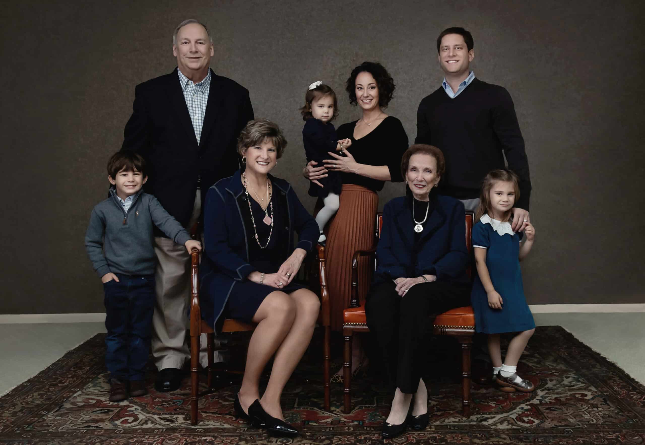 Cook family posing for a photo in front of a truck